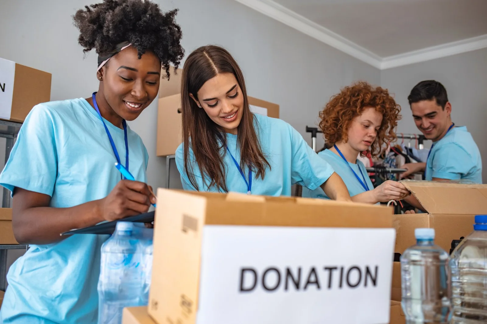 People working together to pack donation boxes